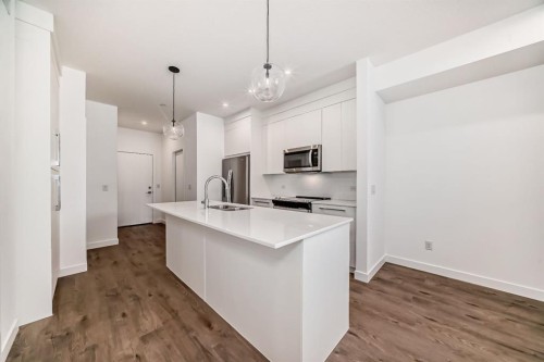 4416-6 Merganser Drive West, Chestermere, AB - Indoor Photo Showing Kitchen With Double Sink With Upgraded Kitchen