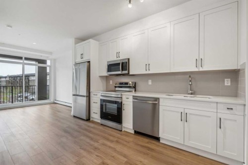 3117-1802 Mahogany Boulevard Se, Calgary, AB - Indoor Photo Showing Kitchen With Stainless Steel Kitchen