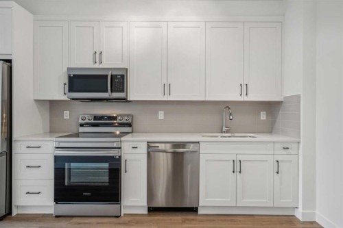 3117-1802 Mahogany Boulevard Se, Calgary, AB - Indoor Photo Showing Kitchen With Stainless Steel Kitchen