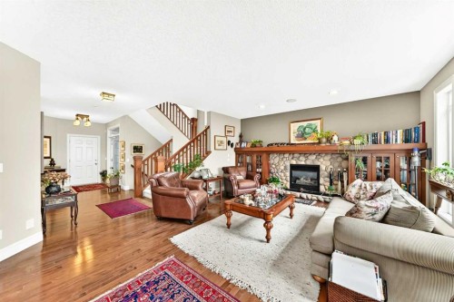 1748 Hidden Creek Way Nw, Calgary, AB - Indoor Photo Showing Living Room With Fireplace