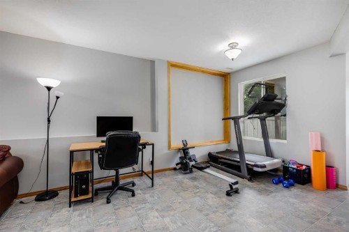 4 Big Springs Hill Se, Airdrie, AB - Indoor Photo Showing Gym Room