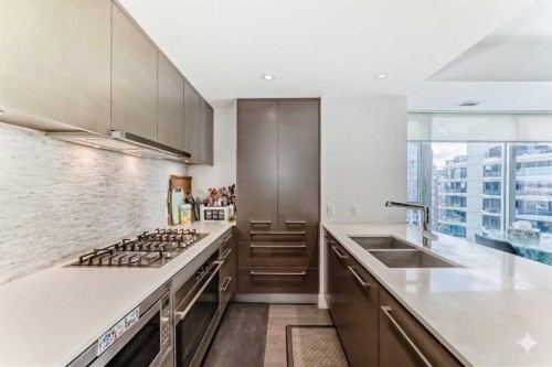 2001-1025 5 Avenue Sw, Calgary, AB - Indoor Photo Showing Kitchen With Double Sink With Upgraded Kitchen