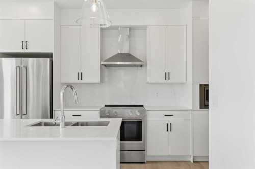 11-1453 Na'A Drive Sw, Calgary, AB - Indoor Photo Showing Kitchen With Double Sink