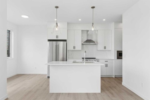 11-1453 Na'A Drive Sw, Calgary, AB - Indoor Photo Showing Kitchen With Double Sink With Upgraded Kitchen