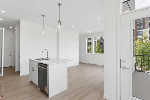 11-1453 Na'A Drive Sw, Calgary, AB - Indoor Photo Showing Kitchen With Double Sink With Upgraded Kitchen
