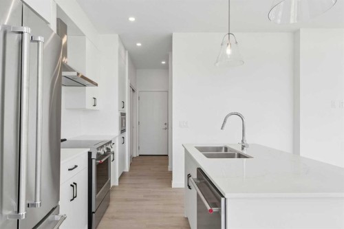 11-1453 Na'A Drive Sw, Calgary, AB - Indoor Photo Showing Kitchen With Stainless Steel Kitchen With Double Sink With Upgraded Kitchen