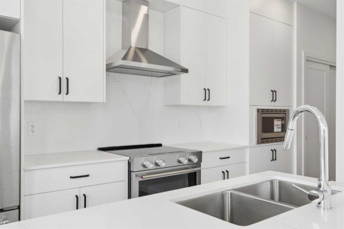 11-1453 Na'A Drive Sw, Calgary, AB - Indoor Photo Showing Kitchen With Stainless Steel Kitchen With Double Sink