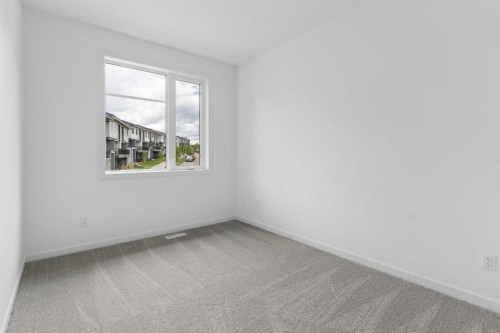 11-1453 Na'A Drive Sw, Calgary, AB - Indoor Photo Showing Other Room