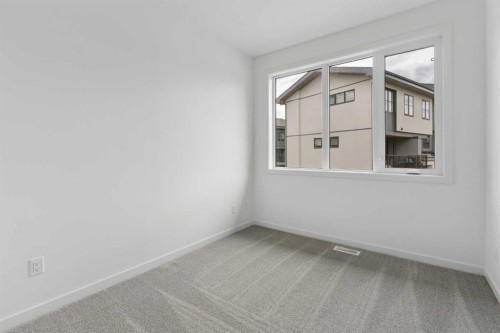 11-1453 Na'A Drive Sw, Calgary, AB - Indoor Photo Showing Other Room
