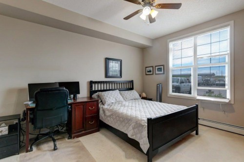 123-1 Crystal Green, Okotoks, AB - Indoor Photo Showing Bedroom