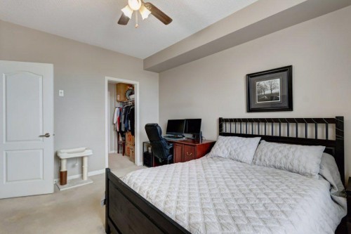 123-1 Crystal Green, Okotoks, AB - Indoor Photo Showing Bedroom