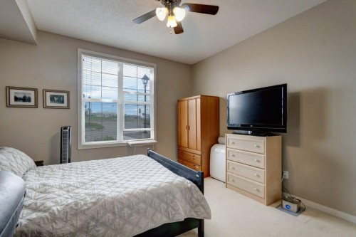 123-1 Crystal Green, Okotoks, AB - Indoor Photo Showing Bedroom