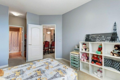 123-1 Crystal Green, Okotoks, AB - Indoor Photo Showing Bedroom