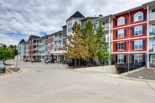 123-1 Crystal Green, Okotoks, AB - Outdoor With Balcony With Facade