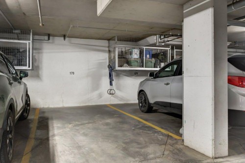 123-1 Crystal Green, Okotoks, AB - Indoor Photo Showing Garage