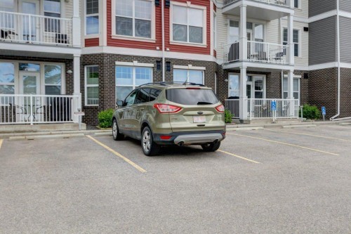 123-1 Crystal Green, Okotoks, AB - Outdoor With Balcony With Facade