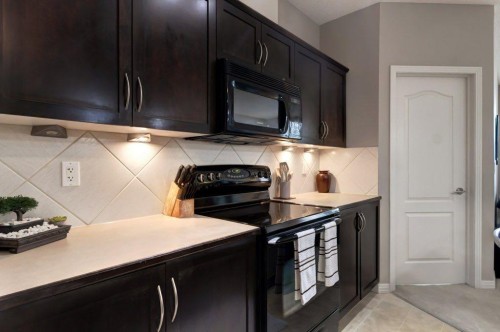 123-1 Crystal Green, Okotoks, AB - Indoor Photo Showing Kitchen
