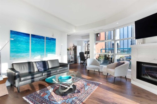1005-205 Riverfront Avenue Sw, Calgary, AB - Indoor Photo Showing Living Room With Fireplace