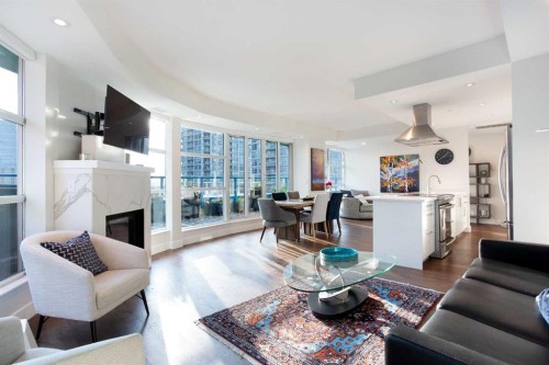 1005-205 Riverfront Avenue Sw, Calgary, AB - Indoor Photo Showing Living Room With Fireplace