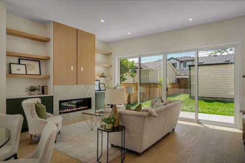 3917 23 Avenue Sw, Calgary, AB - Indoor Photo Showing Living Room With Fireplace