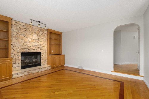 112 Hawkford Crescent Nw, Calgary, AB - Indoor Photo Showing Living Room With Fireplace