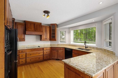 112 Hawkford Crescent Nw, Calgary, AB - Indoor Photo Showing Kitchen With Double Sink