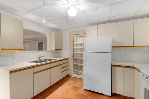 112 Hawkford Crescent Nw, Calgary, AB - Indoor Photo Showing Kitchen With Double Sink