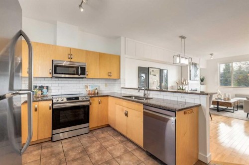 804-281 Cougar Ridge Drive Sw, Calgary, AB - Indoor Photo Showing Kitchen With Double Sink