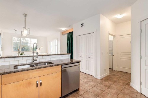 804-281 Cougar Ridge Drive Sw, Calgary, AB - Indoor Photo Showing Kitchen With Double Sink