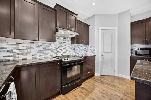 2029 Luxstone Boulevard Sw, Airdrie, AB - Indoor Photo Showing Kitchen With Upgraded Kitchen