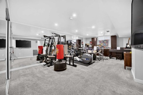 2029 Luxstone Boulevard Sw, Airdrie, AB - Indoor Photo Showing Gym Room