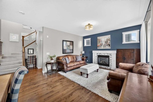 2029 Luxstone Boulevard Sw, Airdrie, AB - Indoor Photo Showing Living Room With Fireplace