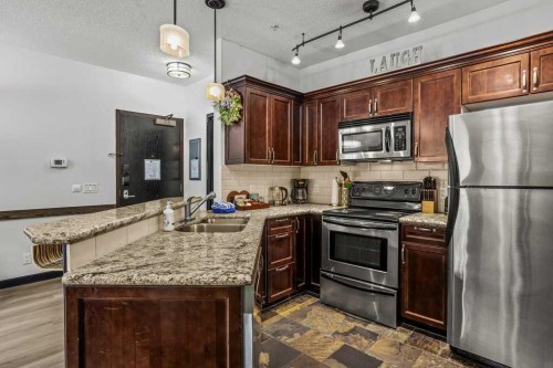 227-901 Mountain Street, Canmore, AB - Indoor Photo Showing Kitchen With Double Sink