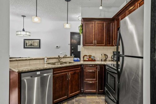 227-901 Mountain Street, Canmore, AB - Indoor Photo Showing Kitchen With Stainless Steel Kitchen With Double Sink