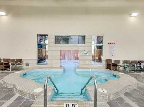 227-901 Mountain Street, Canmore, AB -  Photo Showing Other Room With In Ground Pool