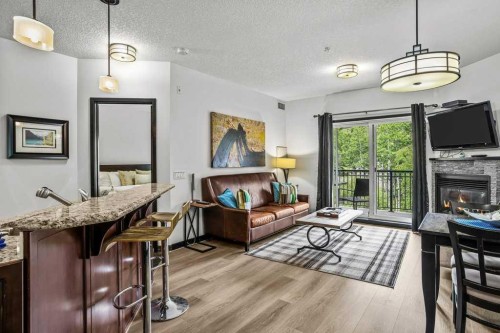 227-901 Mountain Street, Canmore, AB - Indoor Photo Showing Living Room With Fireplace