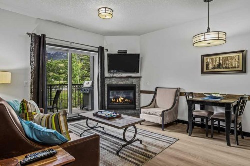 227-901 Mountain Street, Canmore, AB - Indoor With Fireplace