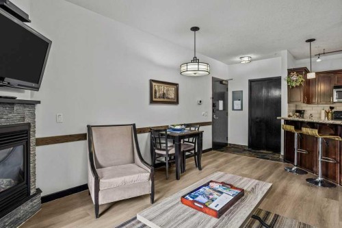 227-901 Mountain Street, Canmore, AB - Indoor Photo Showing Living Room With Fireplace