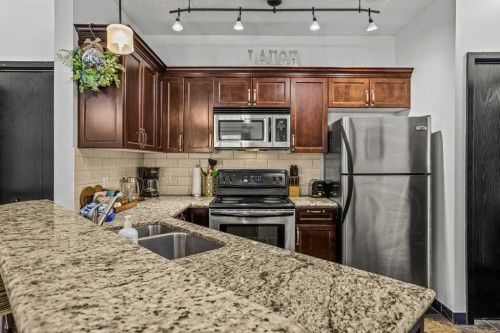 227-901 Mountain Street, Canmore, AB - Indoor Photo Showing Kitchen With Stainless Steel Kitchen With Double Sink