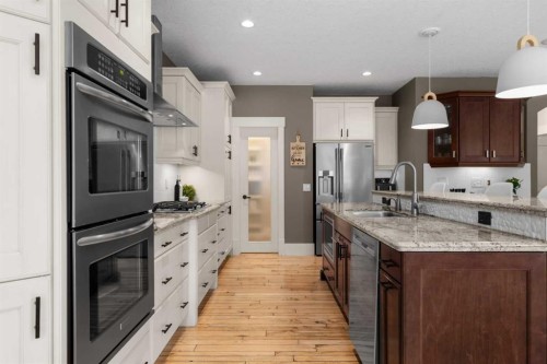 11 Aspen Cliff Place Sw, Calgary, AB - Indoor Photo Showing Kitchen With Double Sink With Upgraded Kitchen