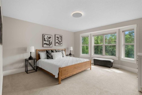 11 Aspen Cliff Place Sw, Calgary, AB - Indoor Photo Showing Bedroom
