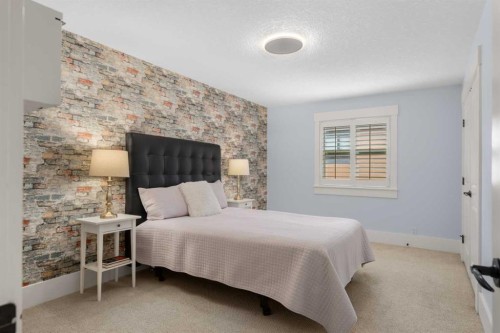 11 Aspen Cliff Place Sw, Calgary, AB - Indoor Photo Showing Bedroom
