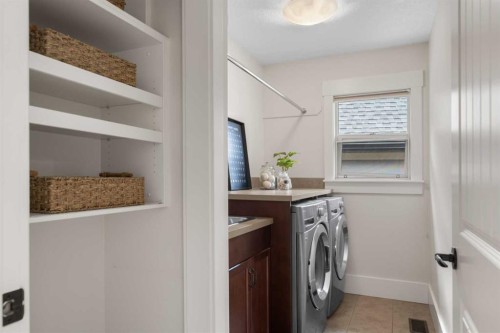 11 Aspen Cliff Place Sw, Calgary, AB - Indoor Photo Showing Laundry Room