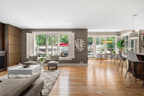 11 Aspen Cliff Place Sw, Calgary, AB - Indoor Photo Showing Living Room With Fireplace