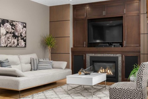 11 Aspen Cliff Place Sw, Calgary, AB - Indoor Photo Showing Living Room With Fireplace