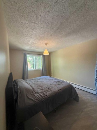 209-315 Heritage Drive Se, Calgary, AB - Indoor Photo Showing Bedroom