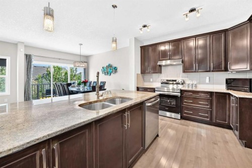 56 Panatella Parade Nw, Calgary, AB - Indoor Photo Showing Kitchen With Double Sink
