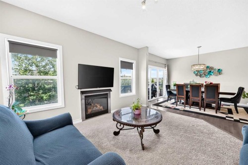 56 Panatella Parade Nw, Calgary, AB - Indoor Photo Showing Living Room With Fireplace