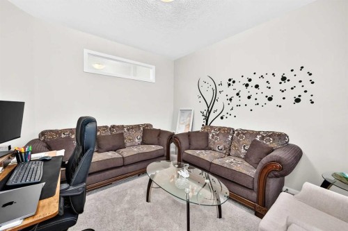 56 Panatella Parade Nw, Calgary, AB - Indoor Photo Showing Living Room