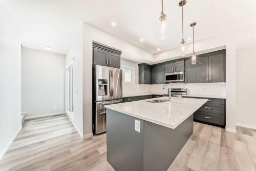 136-42 Cranbrook Gardens Se, Calgary, AB - Indoor Photo Showing Kitchen With Stainless Steel Kitchen With Upgraded Kitchen